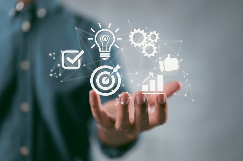 A man is holding a hand with icons on it while preparing for MCCQE1 using Ace QBank and aiming for a high passing score.
