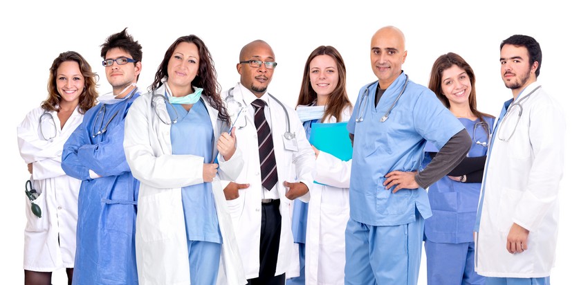 A group of doctors and nurses posing for a photo of the importance of the CanMEDS role.