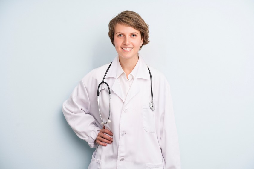 A woman in a white coat, preparing for the MCCQE1 exam.