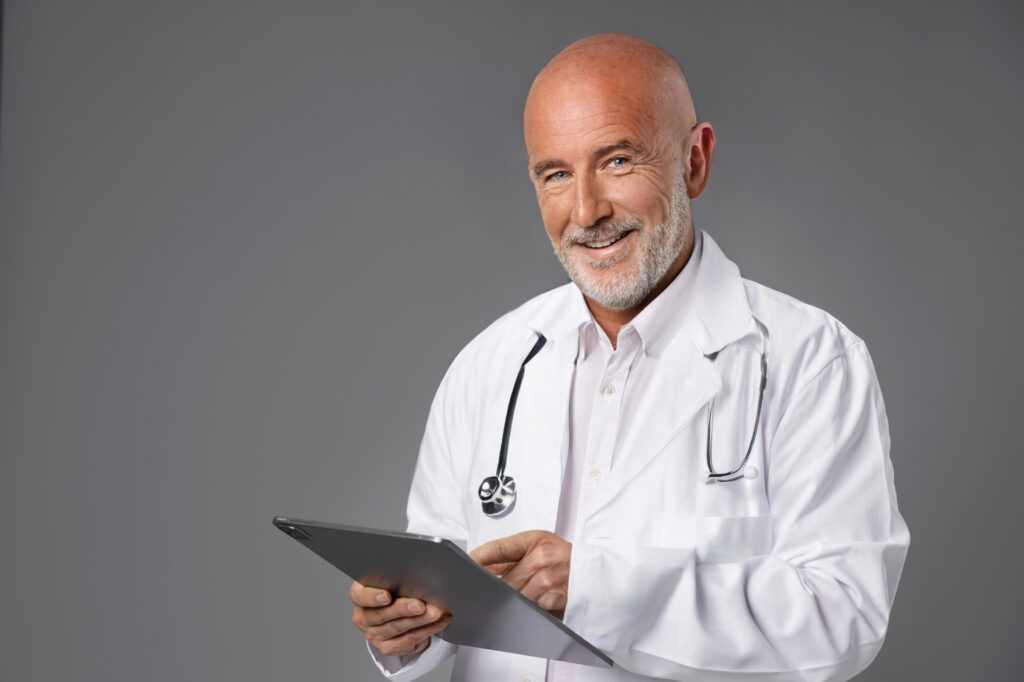 Confident medical professional with an Ace QBank tablet.