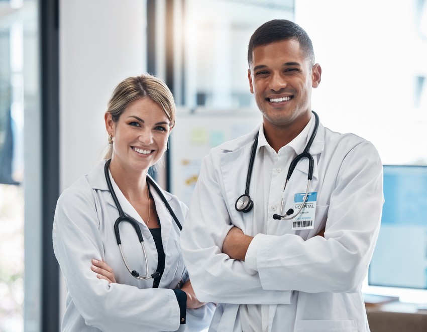 Two IMG doctors posing for a photo after an MCCQE1 exam preparation question bank review session.