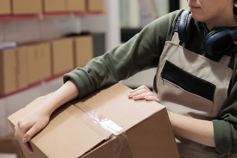 A woman lifting the box-Ace QBank clinical edge