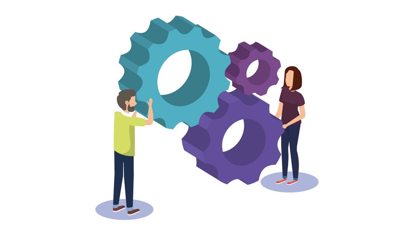 Illustration of a man and a woman standing next to and interacting with three large interlocking gears, symbolizing teamwork in MCCQE1 exam preparation and revealing 3 MCCQE1 Study Secrets for 2026 Success with Ace QBank.