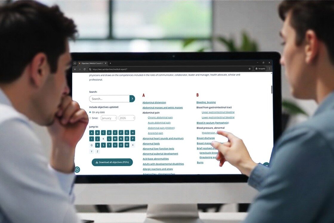 Two people sit at a desk looking at a computer screen displaying medical terms and conditions. Discussing MCCQE1 exam preparation as one person points to the monitor using Ace QBank for effective study.