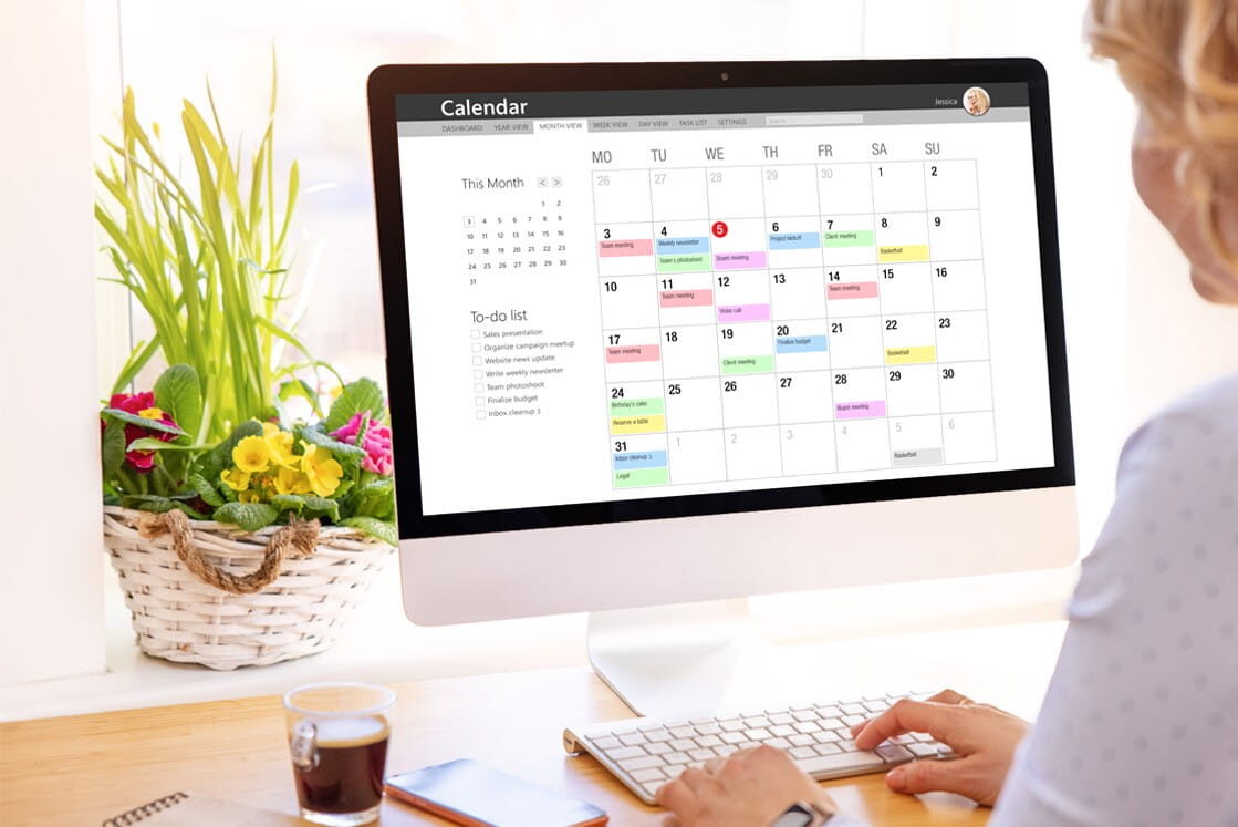 Desktop computer displaying a digital calendar and a person's hands on the keyboard choosing a date to get Ready for August 2026 for MCCQE1 Exam Prep.